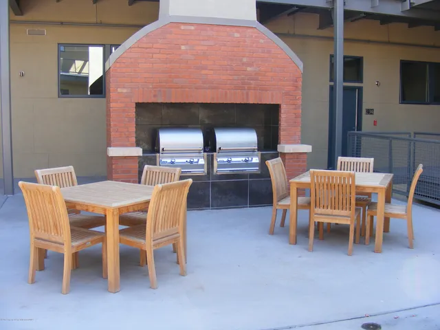 a dining room with furniture and a fireplace