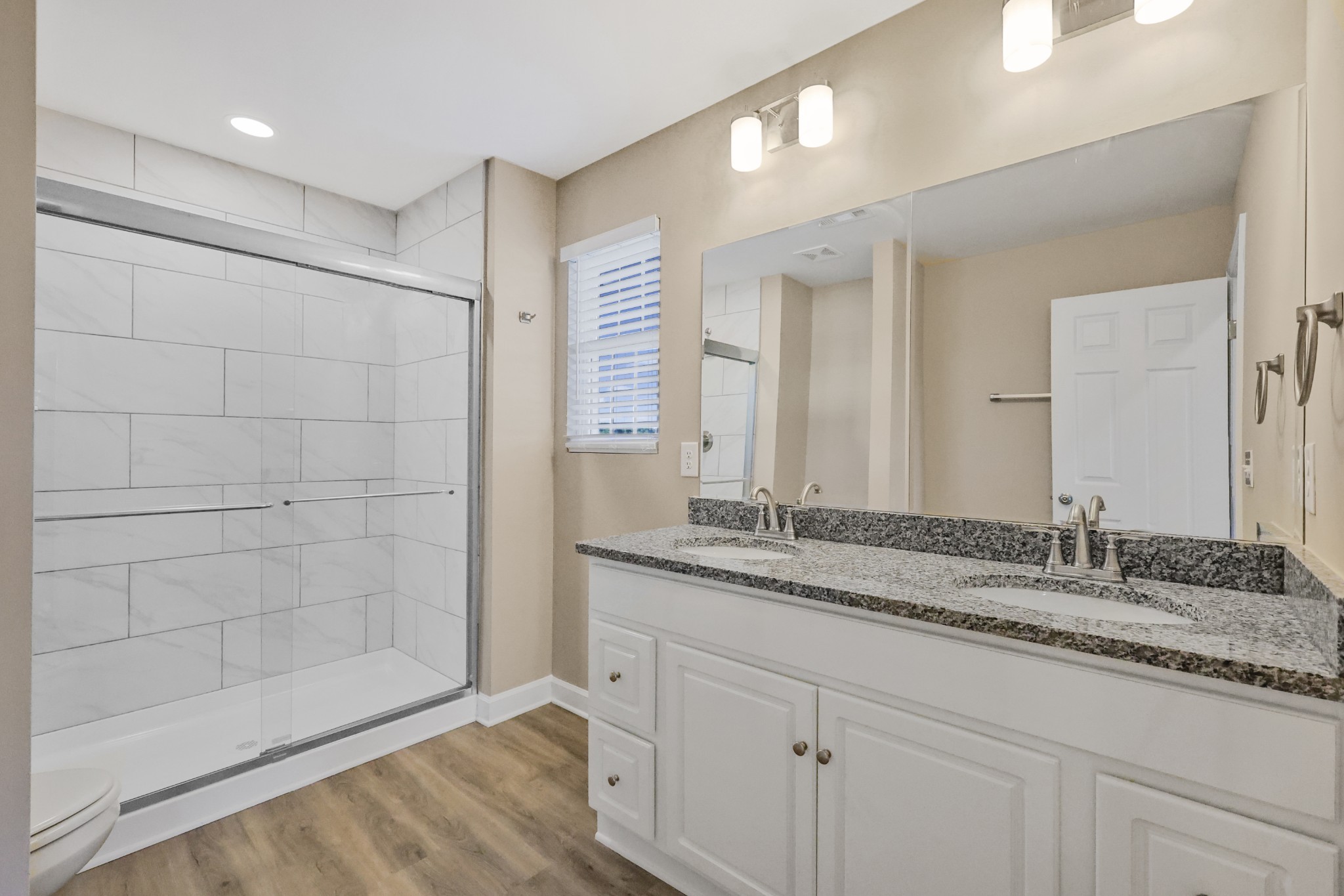 890 Blessing Way Gallatin, TN 37066 - Photo 14 of 19 a bathroom with a granite countertop sink and a mirror