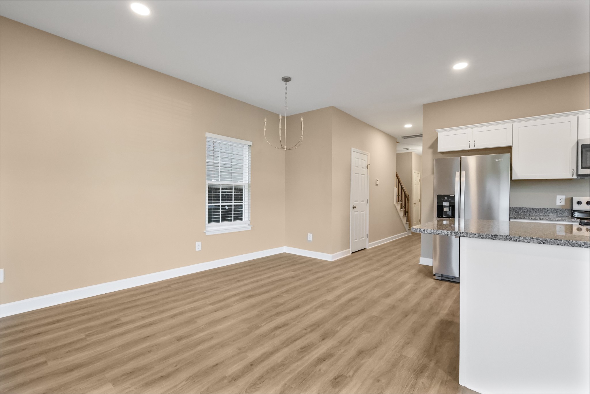 890 Blessing Way Gallatin, TN 37066 - Photo 3 of 19 a view of a kitchen with a sink and a refrigerator