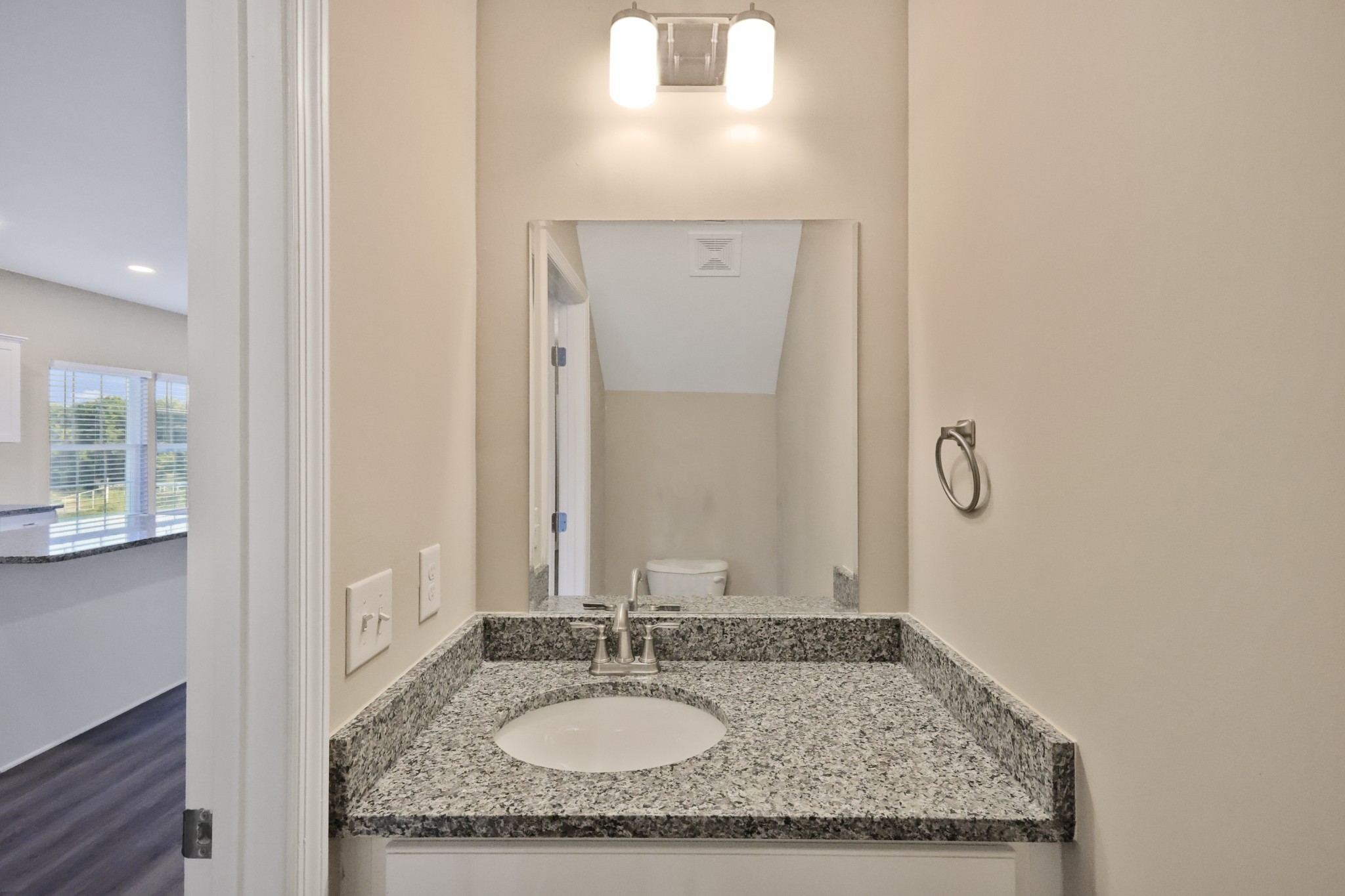 890 Blessing Way Gallatin, TN 37066 - Photo 9 of 19 a bathroom with a granite countertop sink and a mirror