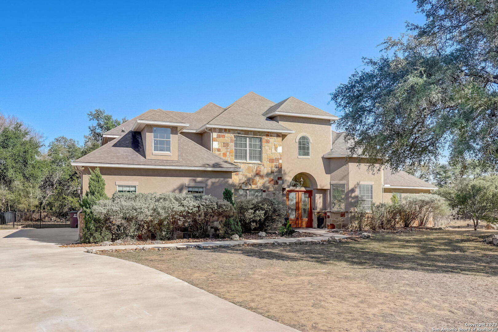 445 Hanging Oak Spring Branch, TX 78070 - Photo 1 of 1 a front view of a house with a yard