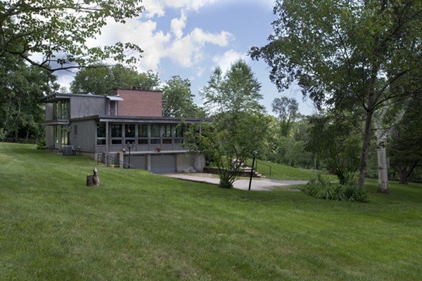 666 Kennedy Road Northampton, MA 01053 - Photo 5 of 30 a view of house with a backyard and a slide