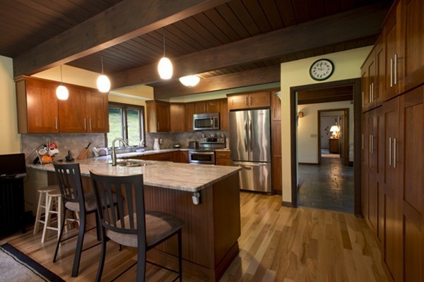 666 Kennedy Road Northampton, MA 01053 - Photo 9 of 30 a view of a kitchen with dining table and chairs