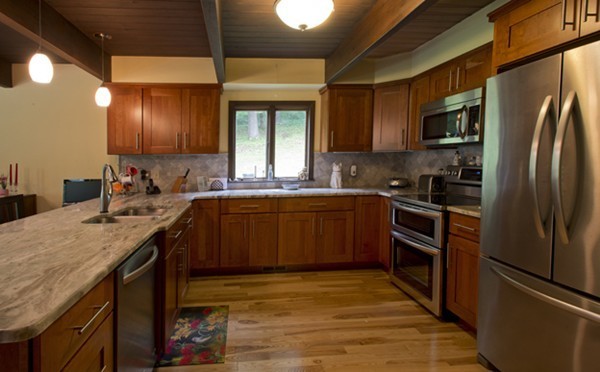 666 Kennedy Road Northampton, MA 01053 - Photo 10 of 30 a kitchen with stainless steel appliances granite countertop a sink a stove and a refrigerator