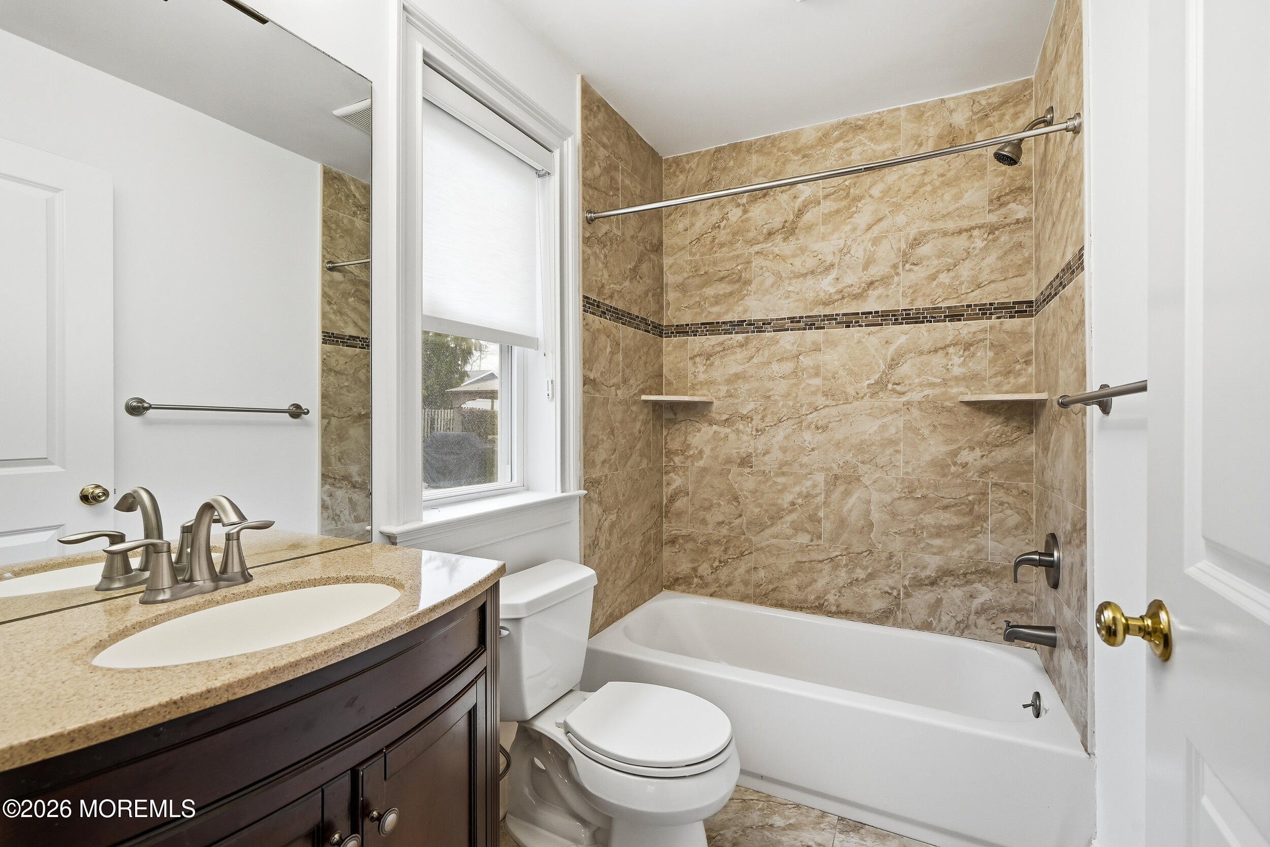 232 Woodcrest Road Oakhurst, NJ 07755 - Photo 23 of 49 a bathroom with a sink a toilet and a bathtub