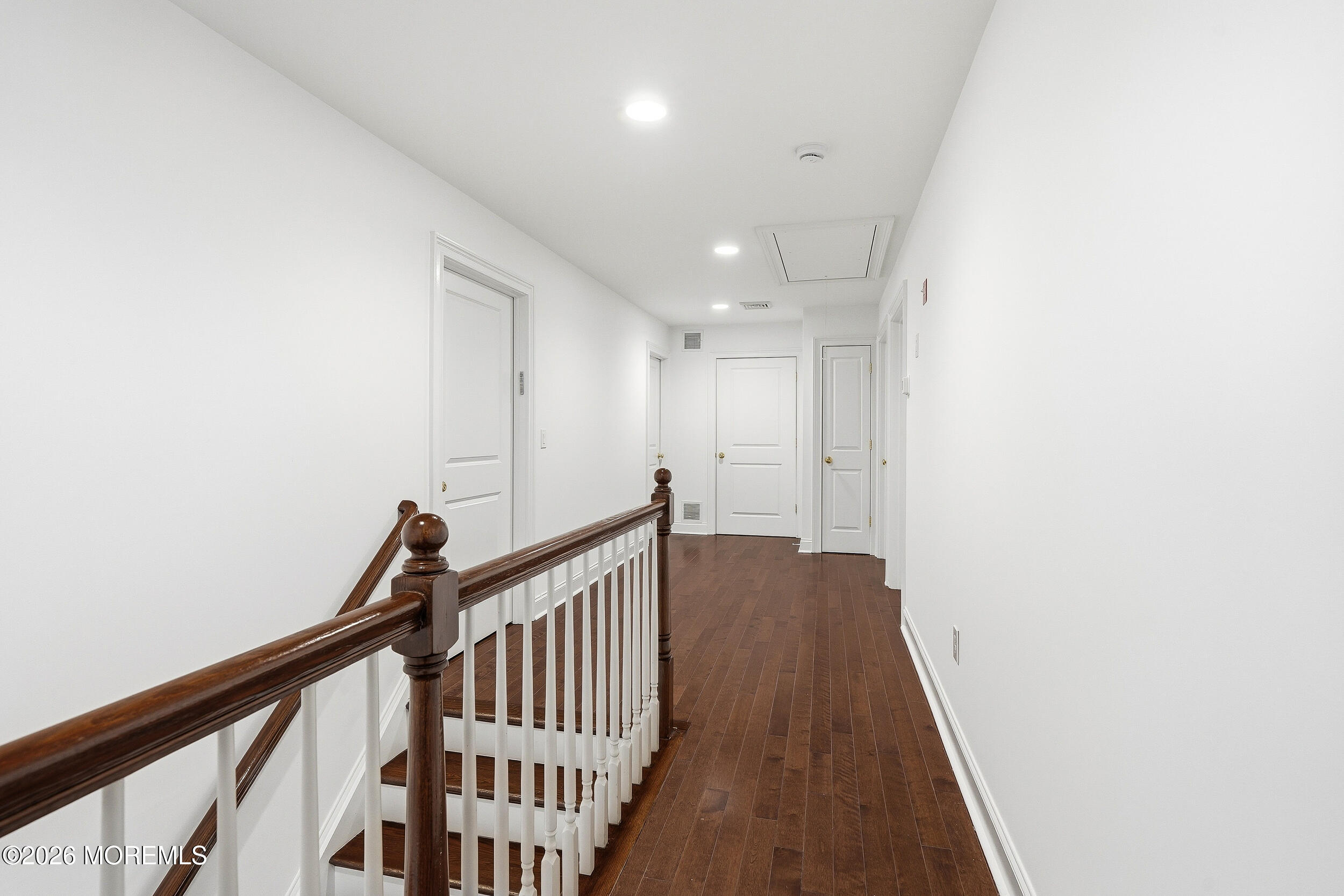 232 Woodcrest Road Oakhurst, NJ 07755 - Photo 38 of 49 a view of a hallway with wooden floor