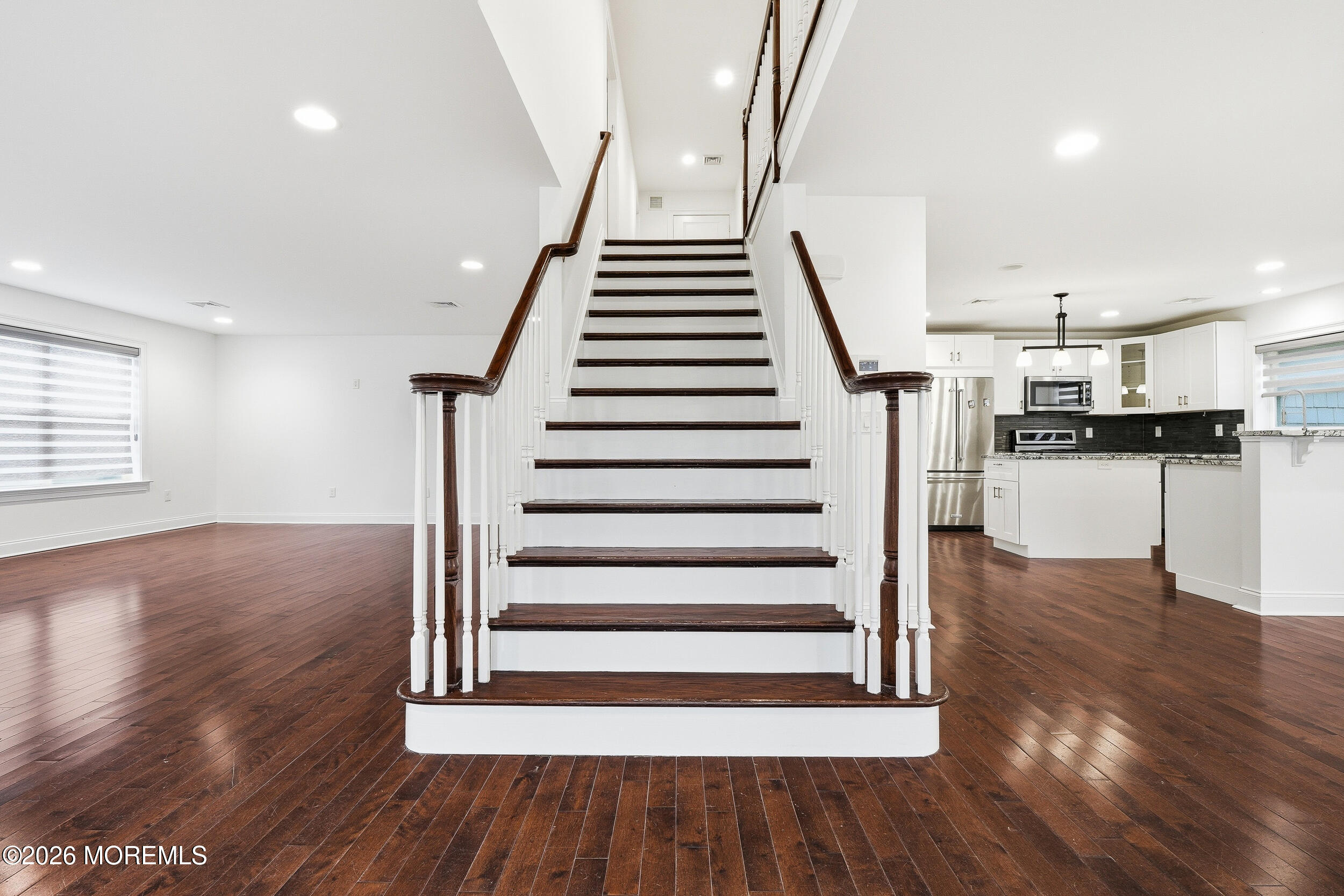 232 Woodcrest Road Oakhurst, NJ 07755 - Photo 8 of 49 a view of entryway and hall with wooden floor