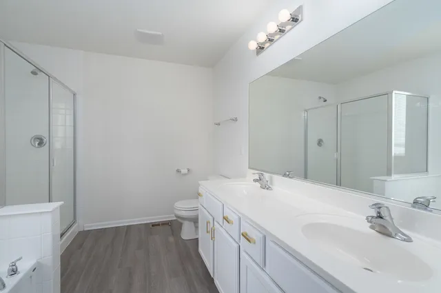 a bathroom with a bathtub and a shower