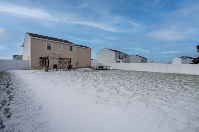 a view of a big room with wooden fence