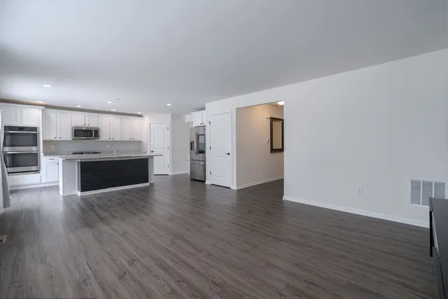 a view of a kitchen with a sink and a stove top oven
