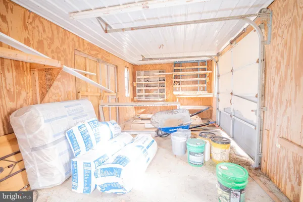 a dining room with furniture and a large window