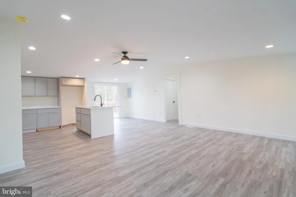a view of kitchen with wooden floor and window