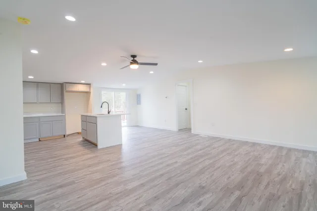 a view of kitchen with wooden floor and window