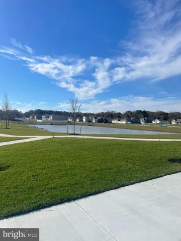 a view of a lake with a big yard
