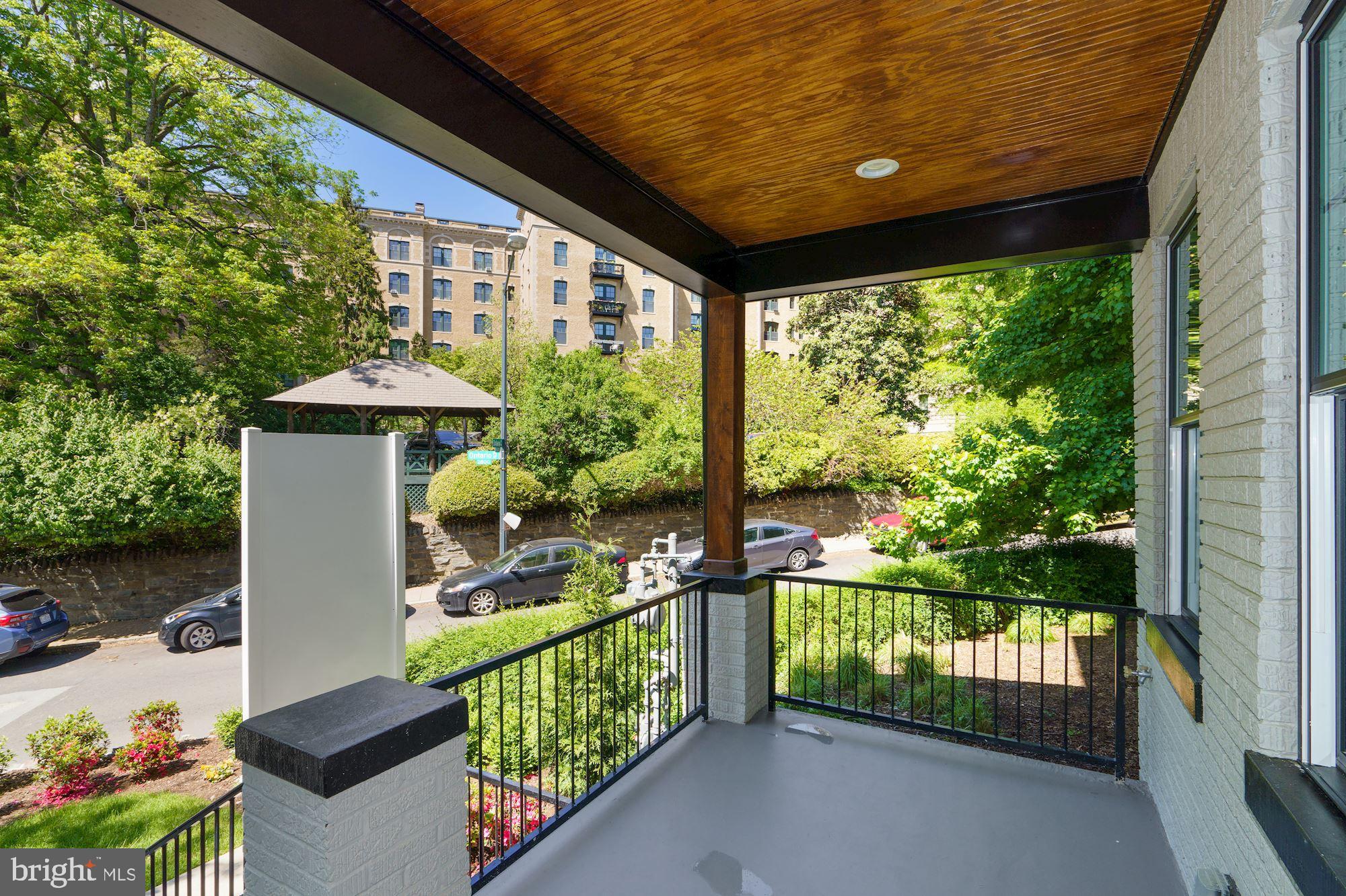 1808 Ontario Place Northwest, Unit 1 Washington, DC 20009 - Photo 2 of 27 a front view of a house with garden