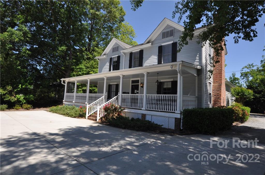 5 Oak Grove Street, Unit 4 Mount Holly, NC 28120 - Photo 1 of 10 a front view of a house with a yard