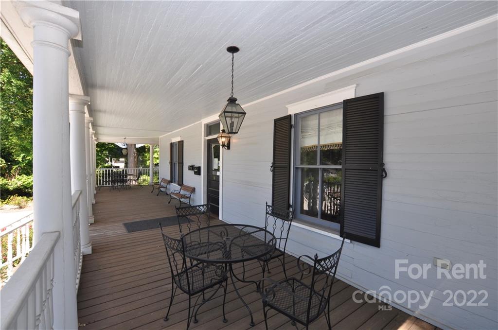 5 Oak Grove Street, Unit 4 Mount Holly, NC 28120 - Photo 3 of 10 a view of a house with backyard and furniture