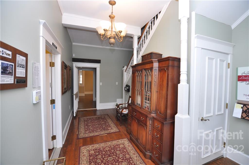 5 Oak Grove Street, Unit 4 Mount Holly, NC 28120 - Photo 7 of 10 a view of a hallway view with staircase