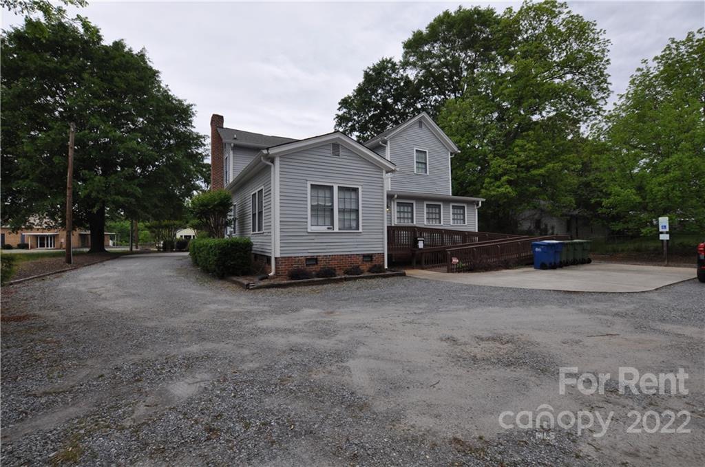 5 Oak Grove Street, Unit 4 Mount Holly, NC 28120 - Photo 10 of 10 a view of a house with a outdoor space