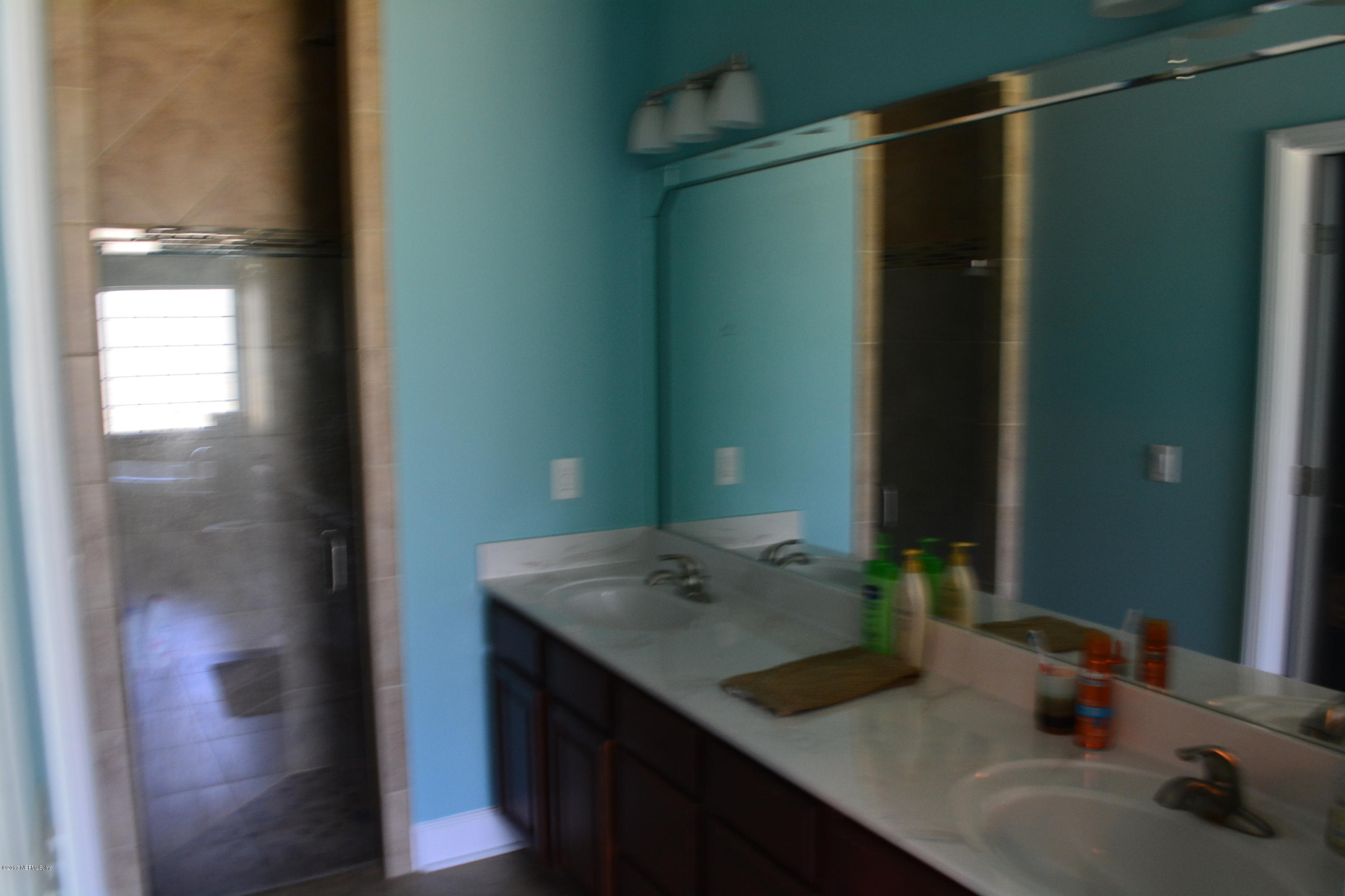 5345 Eva Jones Road Macclenny, FL 32063 - Photo 13 of 22 a bathroom with a sink and a mirror