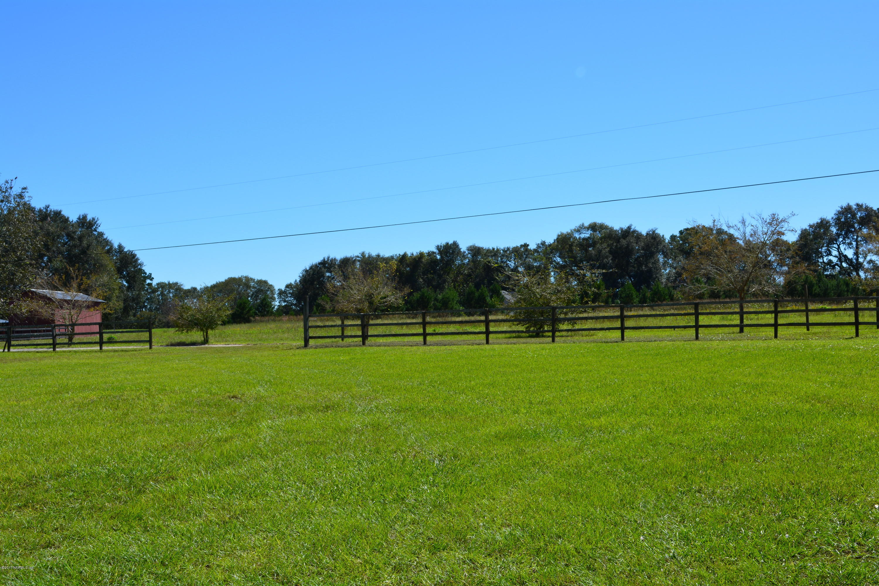 5345 Eva Jones Road Macclenny, FL 32063 - Photo 18 of 22 a view of a golf course with a lake