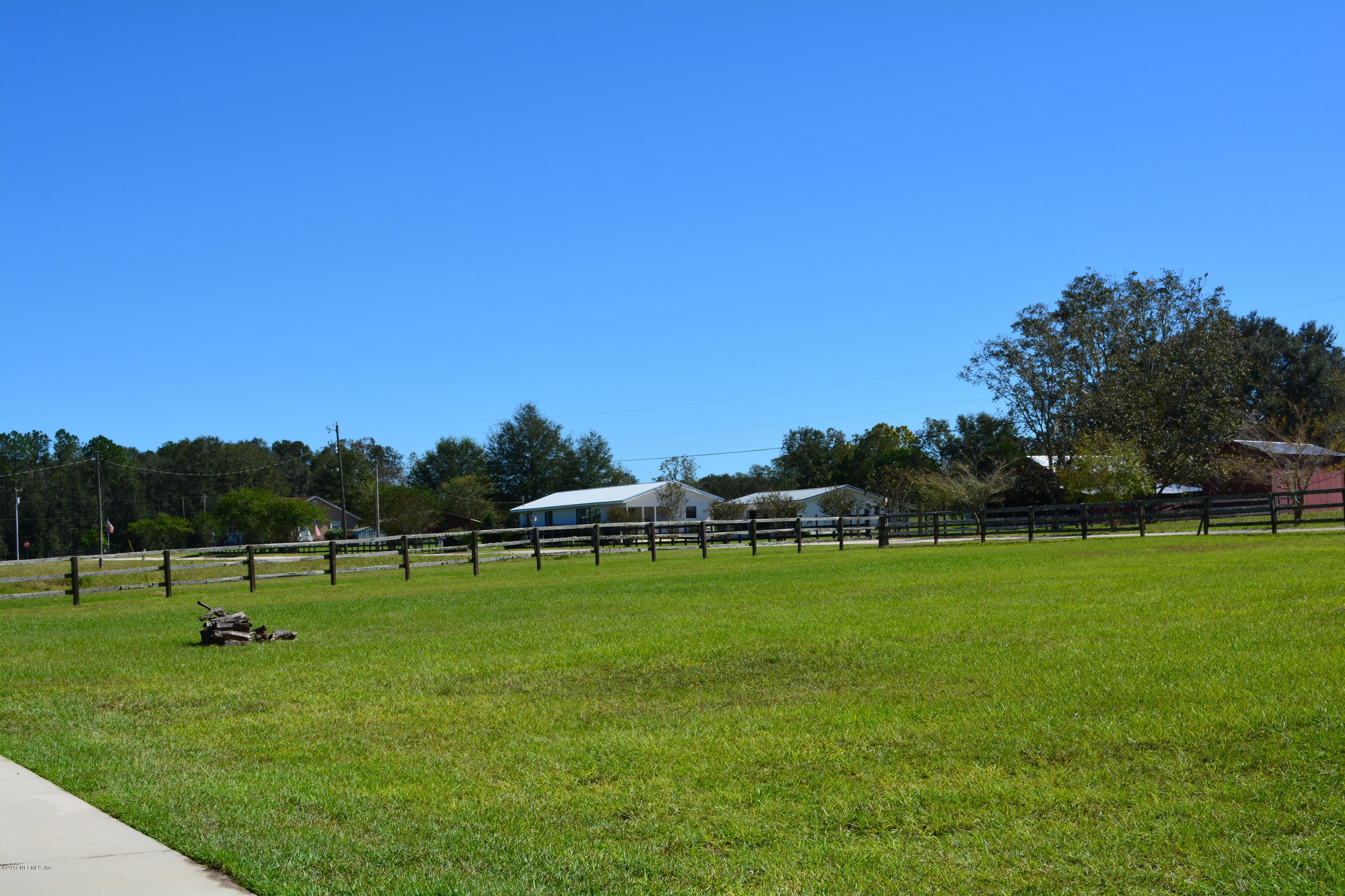 5345 Eva Jones Road Macclenny, FL 32063 - Photo 20 of 22 a view of grassy field with trees