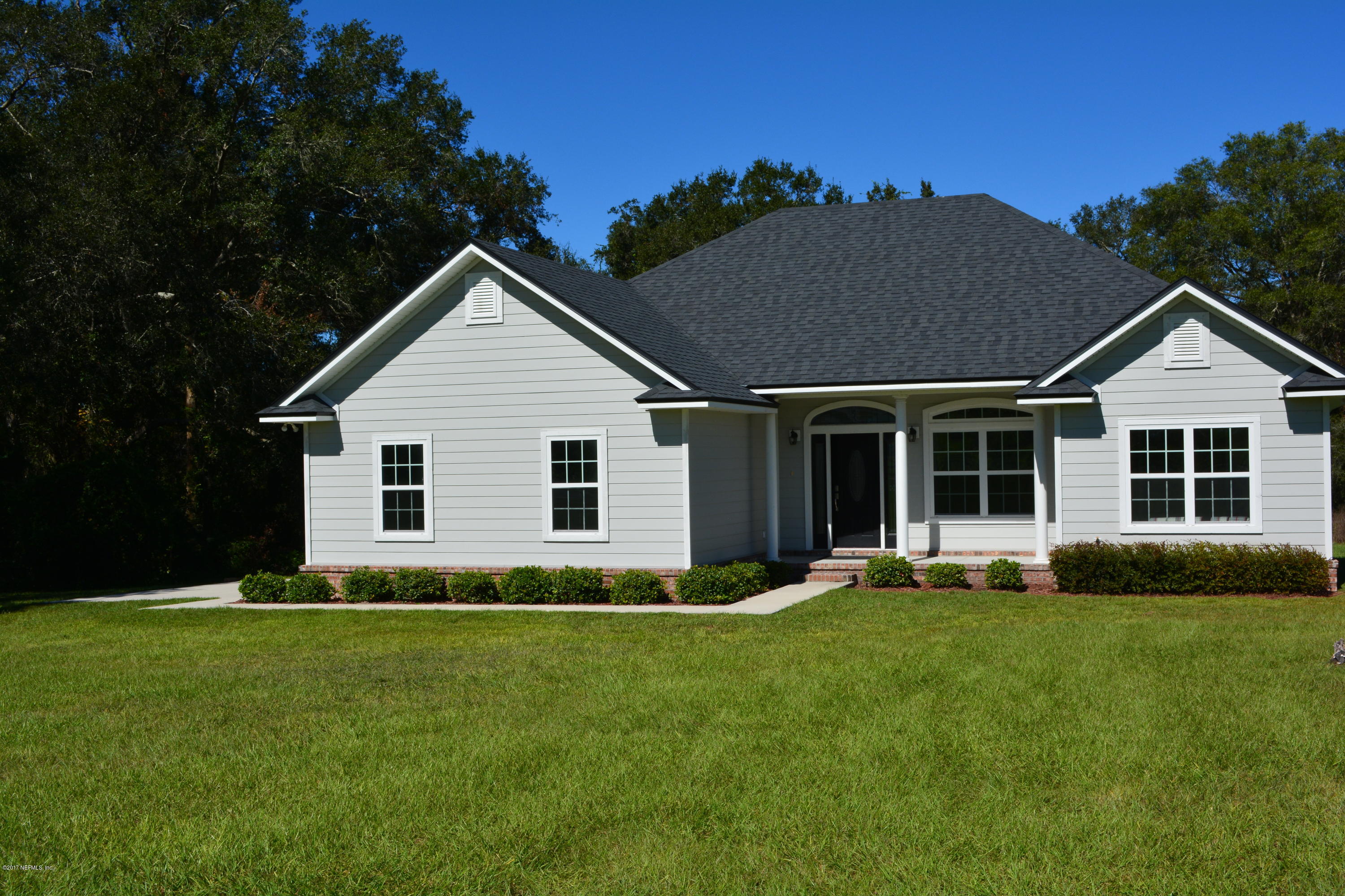 5345 Eva Jones Road Macclenny, FL 32063 - Photo 2 of 22 a front view of house with yard and green space