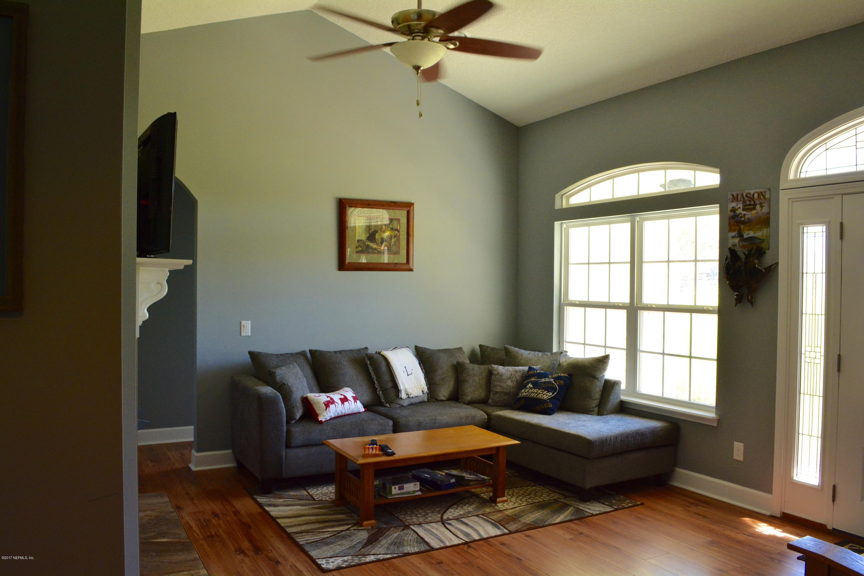 5345 Eva Jones Road Macclenny, FL 32063 - Photo 21 of 22 a living room with furniture and a window