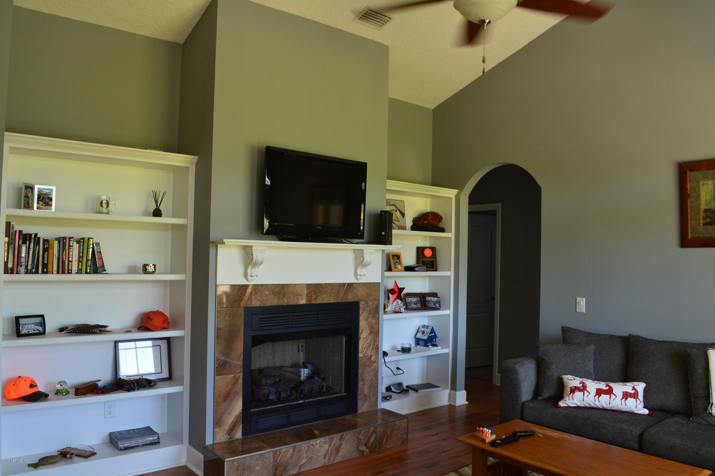 5345 Eva Jones Road Macclenny, FL 32063 - Photo 7 of 22 a living room with furniture and a fireplace