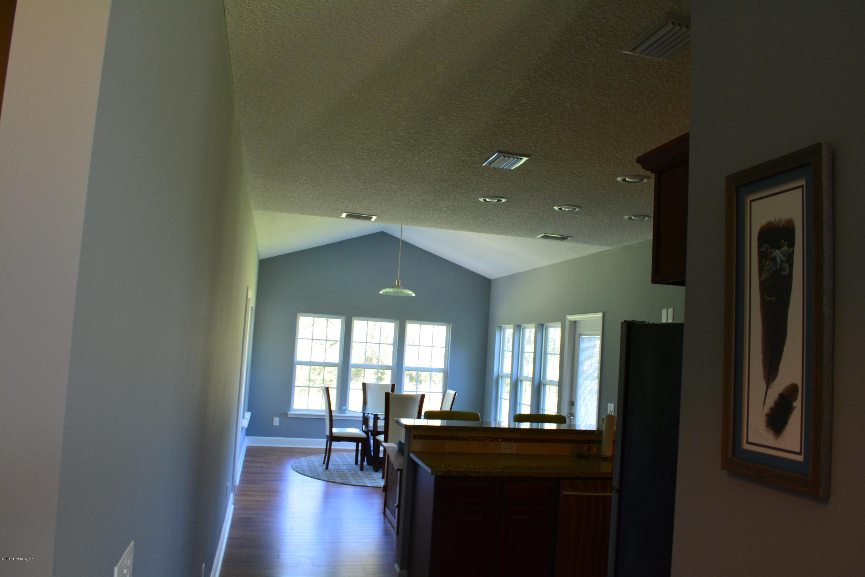 5345 Eva Jones Road Macclenny, FL 32063 - Photo 8 of 22 a view of a workspace with furniture and window