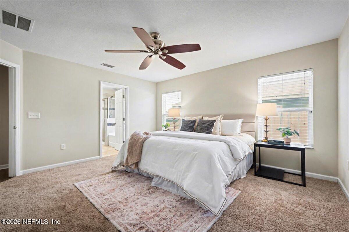 7401 Steventon Way Jacksonville, FL 32244 - Photo 21 of 32 a spacious bedroom with a bed and a window