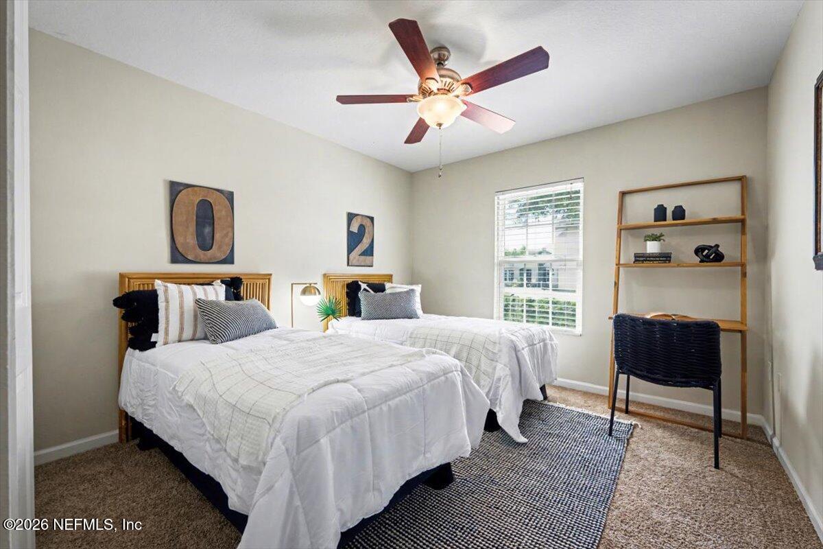 7401 Steventon Way Jacksonville, FL 32244 - Photo 22 of 32 a bedroom with a bed and wooden floor