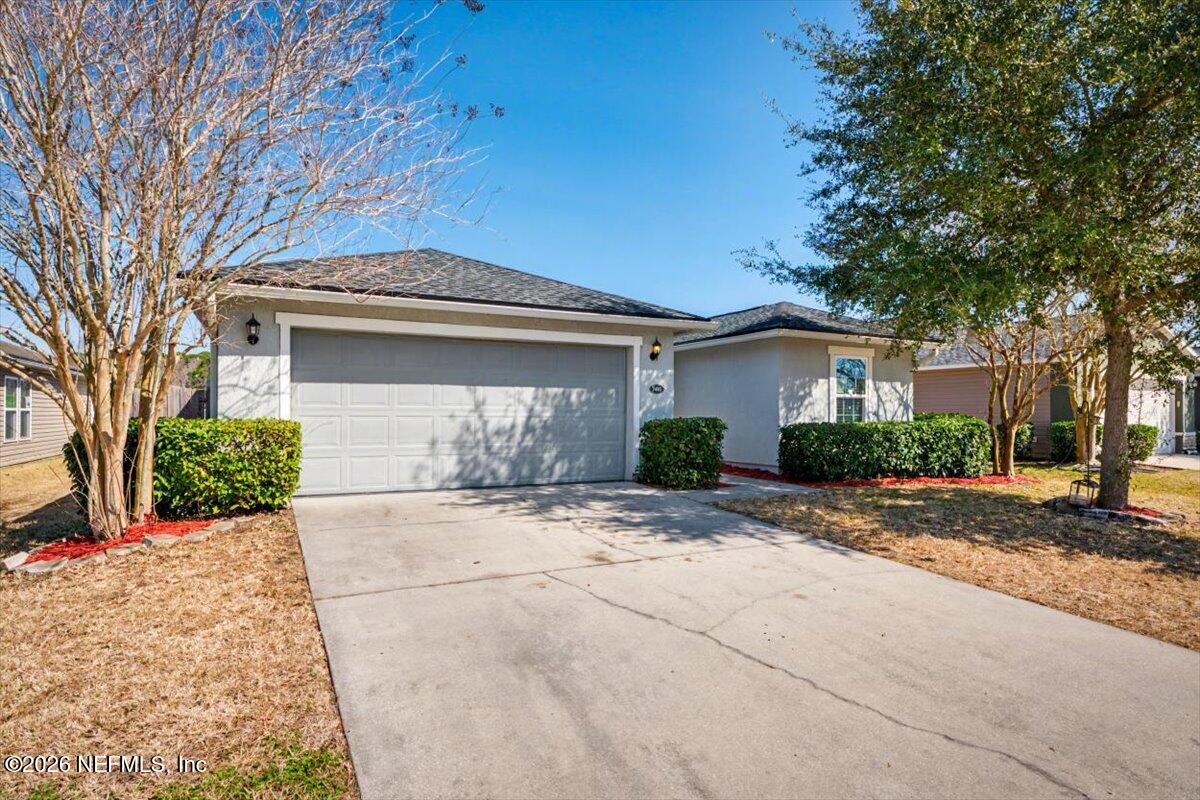 7401 Steventon Way Jacksonville, FL 32244 - Photo 3 of 32 a front view of a house with a yard