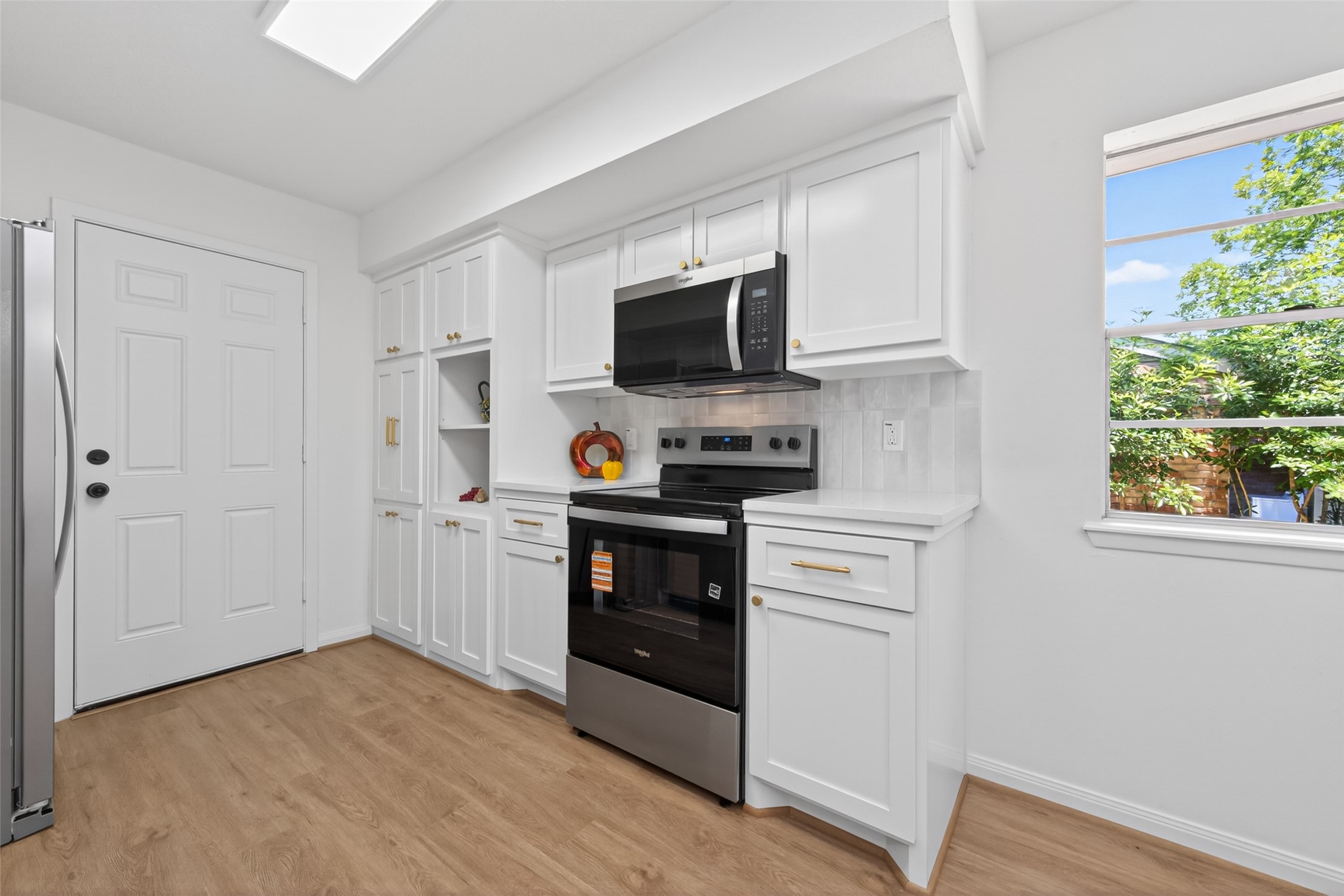 503 Allison Street Conroe, TX 77303 - Photo 13 of 34 Experience modern convenience with brand-new appliances, including a sleek refrigerator.