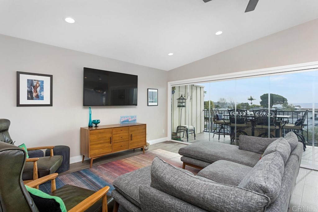 620 West Solana Circle, Unit 3A Solana Beach, CA 92075 - Photo 11 of 37 a living room with furniture and a flat screen tv