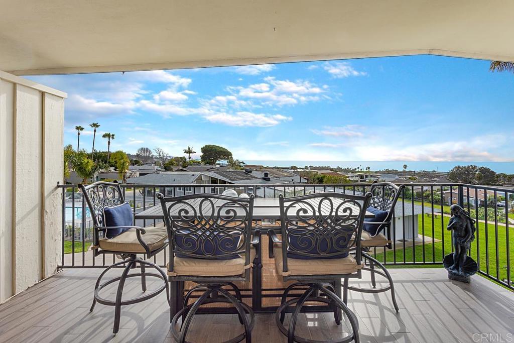 620 West Solana Circle, Unit 3A Solana Beach, CA 92075 - Photo 13 of 37 a view of a chairs and table on the wooden deck