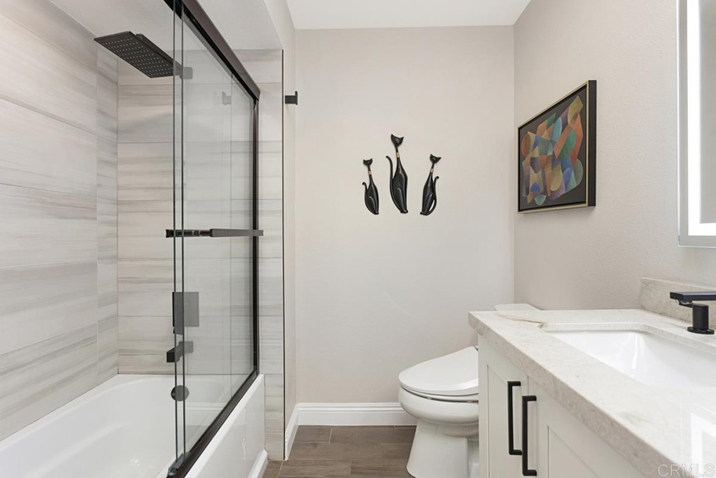 620 West Solana Circle, Unit 3A Solana Beach, CA 92075 - Photo 15 of 37 a bathroom with a sink a toilet and shower