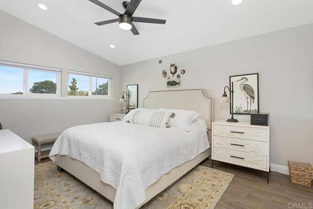 620 West Solana Circle, Unit 3A Solana Beach, CA 92075 - Photo 17 of 37 a bedroom with a bed and wooden floor