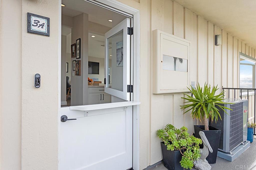 620 West Solana Circle, Unit 3A Solana Beach, CA 92075 - Photo 25 of 37 hallway with potted plant in front of it