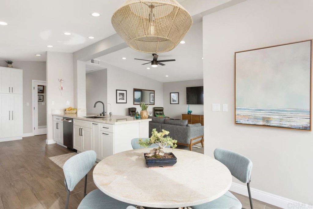 620 West Solana Circle, Unit 3A Solana Beach, CA 92075 - Photo 9 of 37 a dining room with furniture and wooden floor