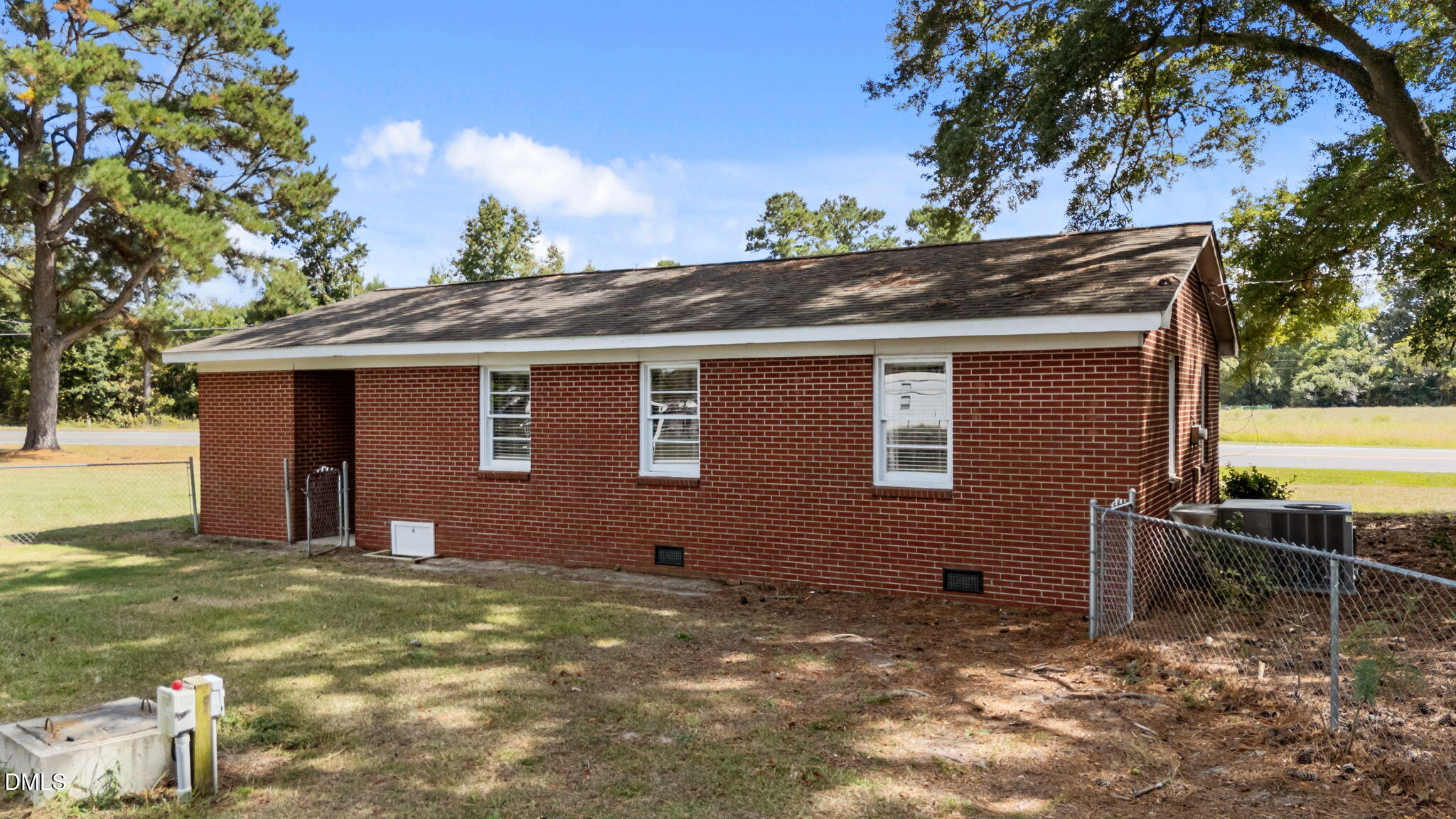 382 East Evans Road Princeton, NC 27569 - Photo 2 of 4 a view of house with backyard
