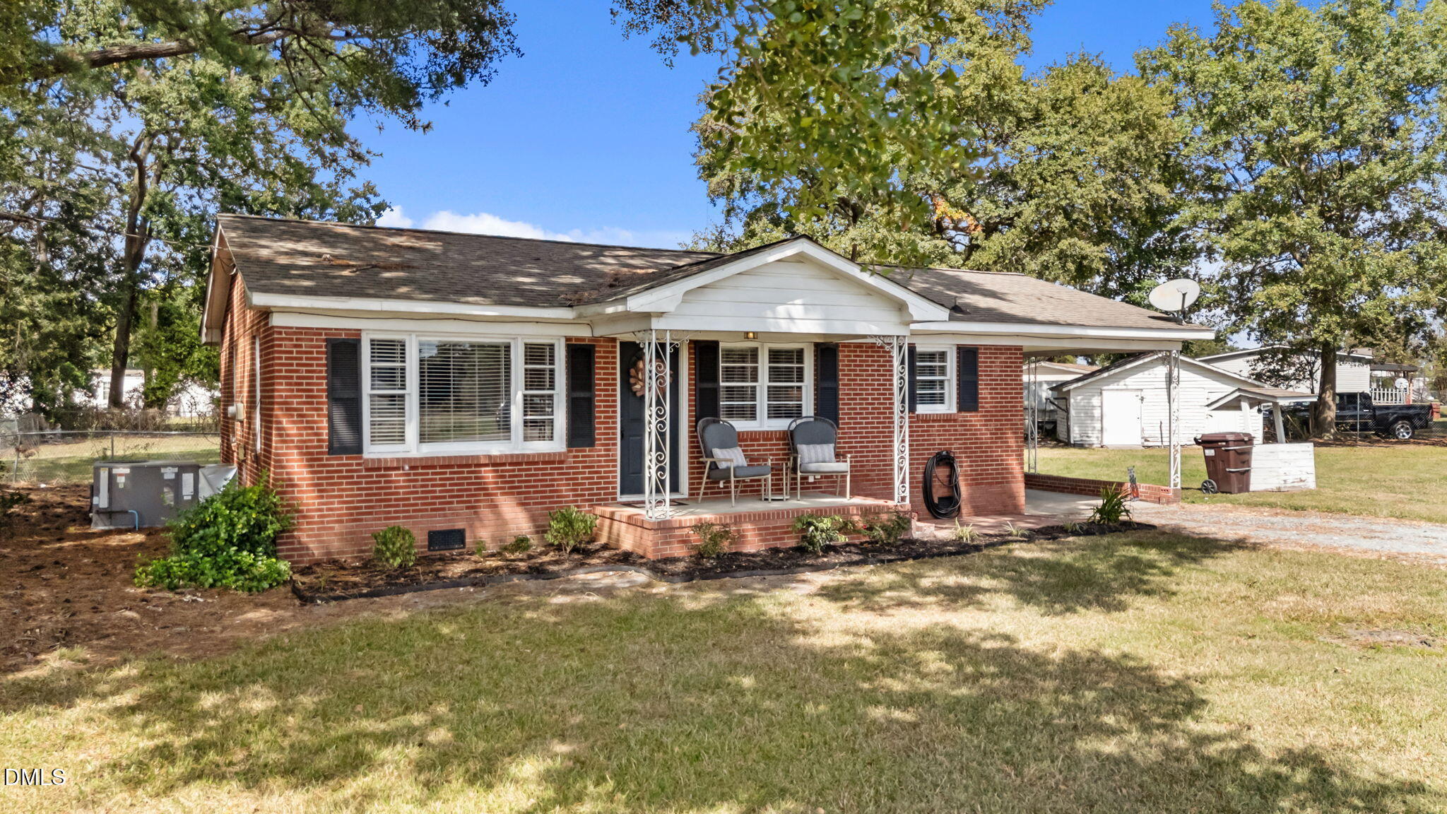 382 East Evans Road Princeton, NC 27569 - Photo 3 of 4 a front view of a house with a yard