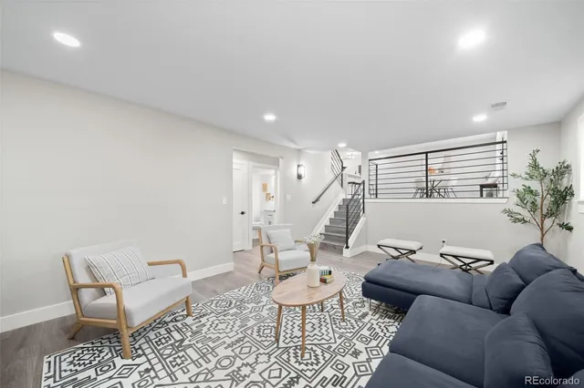 a living room with furniture and a rug