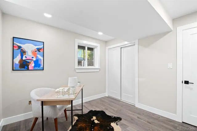 a workspace with furniture and wooden floor