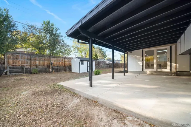 a front view of a house with a yard and outdoor seating