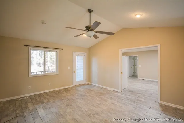 a view of an empty room with a window