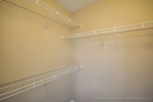 a view of a room with racks on the wall