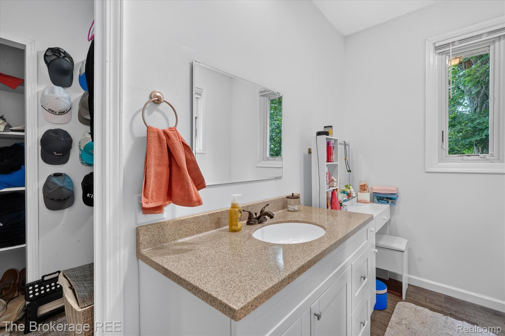 13269 North Genesee Road Clio, MI 48420 - Photo 34 of 67 Bathroom vanity with an integrated sink, granite-style countertop, and white cabinetry