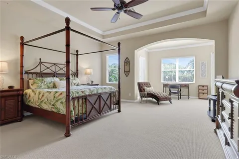 a bedroom with furniture and a window