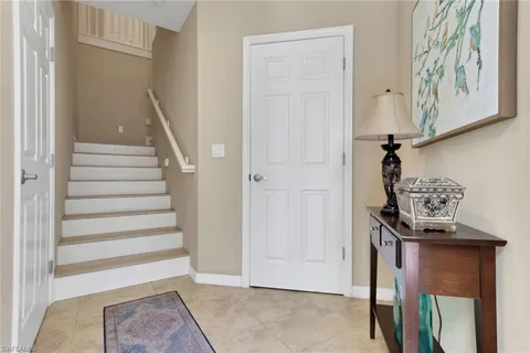 a view of front door with stairs